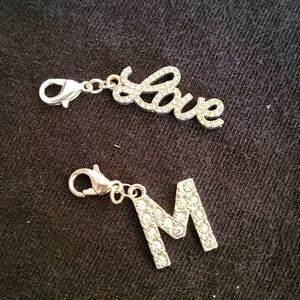 2 silver charms with rhinestones